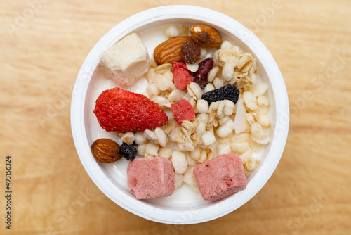 top view yogurt with nuts and dry fruits and melon seeds