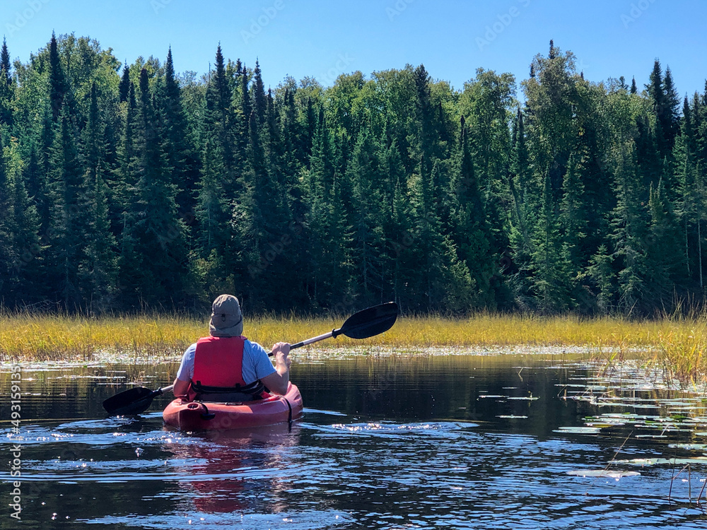 Kayaking on a remote lake in Northern Minnesota is a wonderful way to enjoy nature
