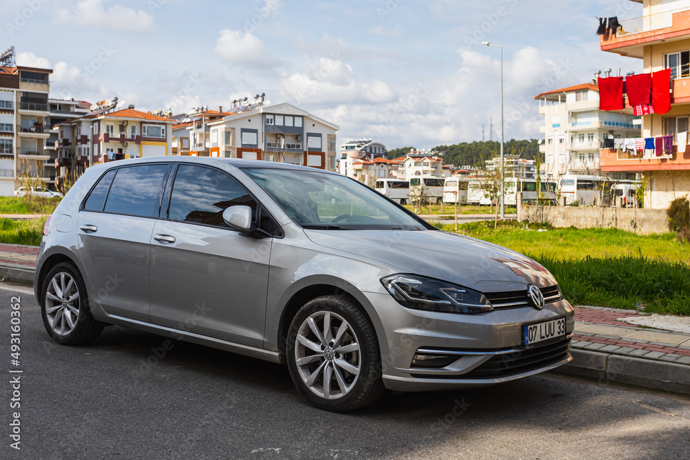 Side, Turkey -February 28, 2022: gray Volkswagen Golf is parked on the  street on a summer day against the backdrop of a buildung, trees, shops  Stock Photo | Adobe Stock