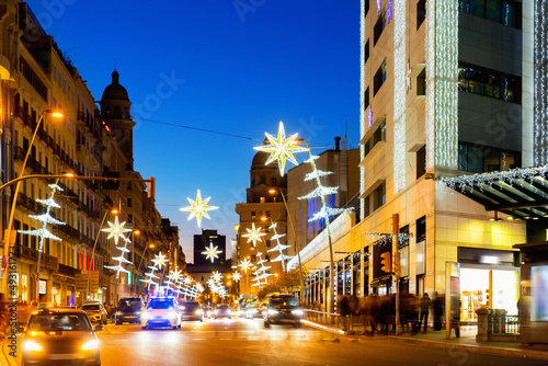 Christmas decorations on the streets in Barcelona in the evening, Catalonia, Spain