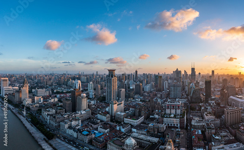Aerial view of city skyline and modern buildings in Shanghai at sunset, China.