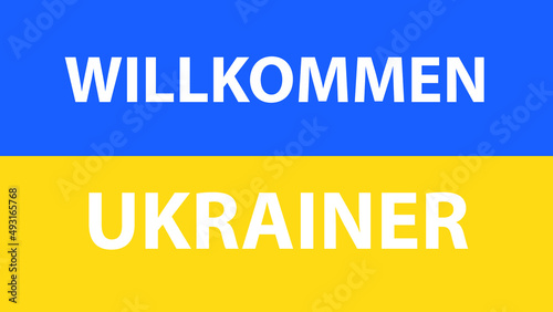 FLAG OF UKRAINE WITH THE PHRASE WELCOME UKRAINIANS IN GERMAN