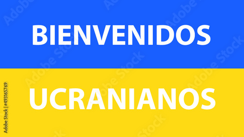 FLAG OF UKRAINE WITH THE PHRASE WELCOME UKRAINIANS IN SPANISH © Victor Photo Stock