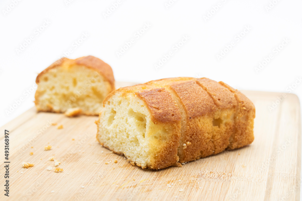 Pound cake on cutting board isolated on white background Pound cake on cutting board isolated on white background