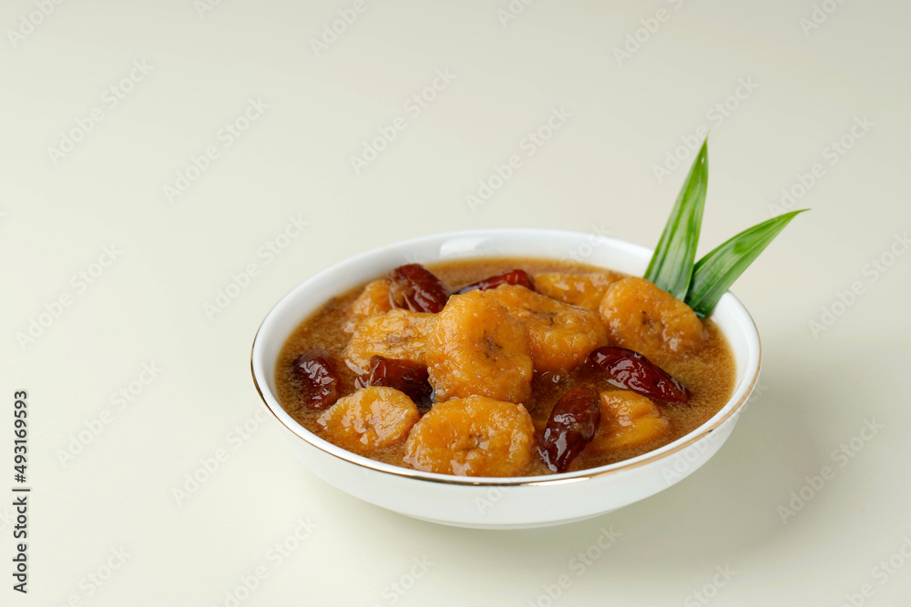 Kolak Pisang Kurma, Banana Compote with Dates Fruit, Popular Food Beverages for Iftar. Kolak Made from Coconut Milk and Palm Sugar Kolak Pisang Kurma, Banana Compote with Dates Fruit, Popular Food Beverages for Iftar. Kolak Made from Coconut Milk and Palm Sugar