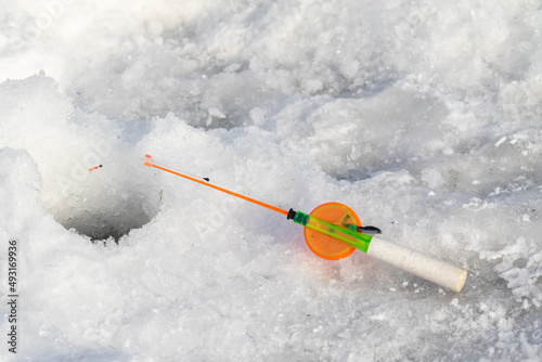Fishing rod for winter fishing on the ice at the hole.