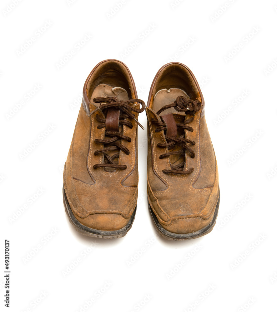 Old leather shoes on a white background.