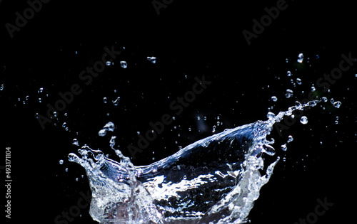 Water scattered on a black background. Water splashing on a black background. isolated splash on black background