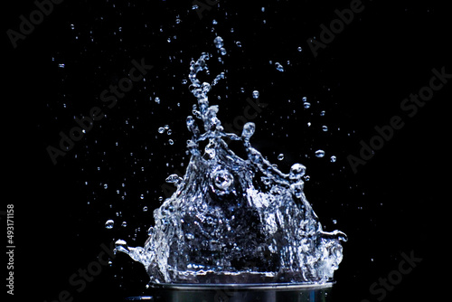 Water scattered on a black background. Water splashing on a black background. isolated splash on black background