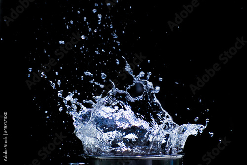 Water scattered on a black background. Water splashing on a black background. isolated splash on black background