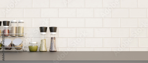 Set of spice bottles or seasoning bottles and copy space on kitchen countertop