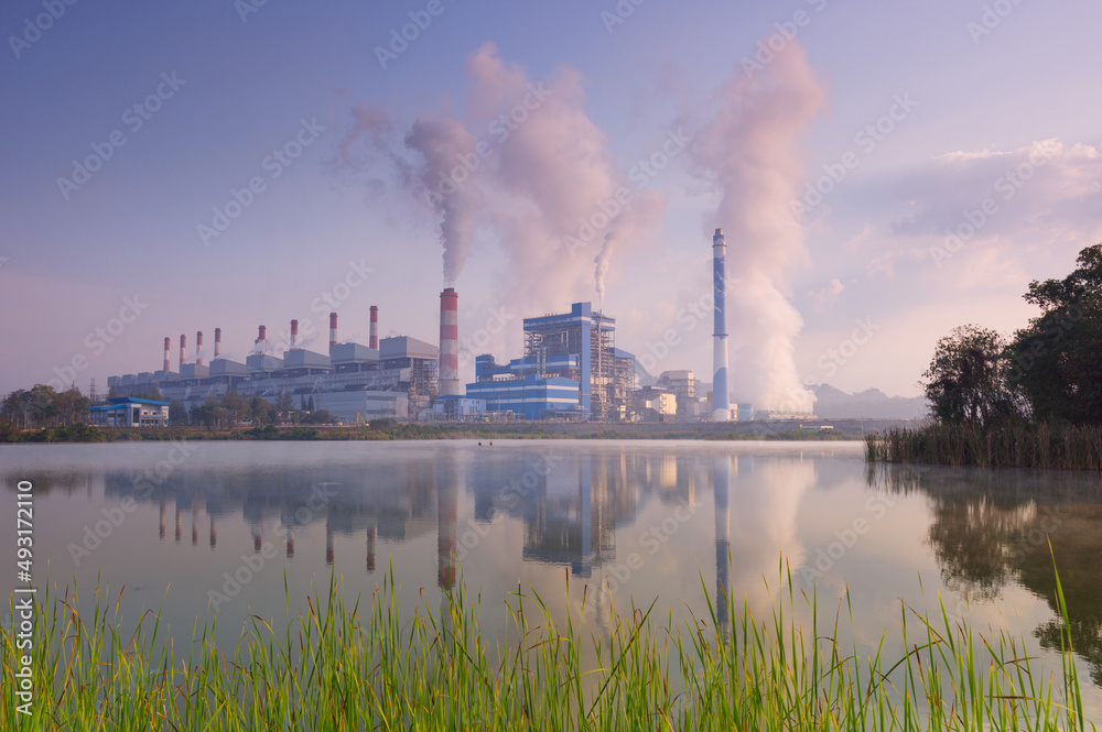 Industrial landscape, coal power plants smoke, industrial pollution causes atmospheric pollution and environmental problems, eco industrial scene. Mae Moh, Lampang.