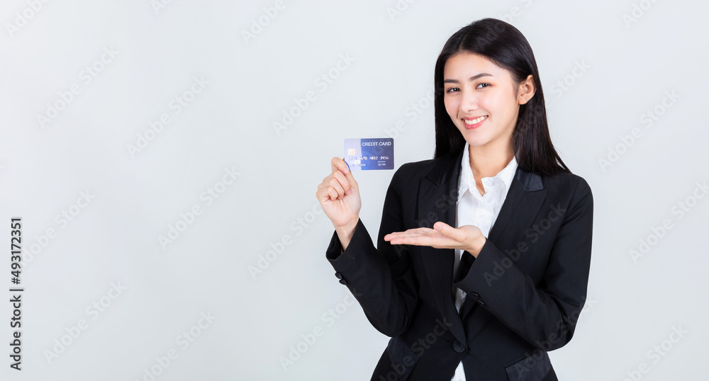 asian business woman wearing office clothing hands show credit card ,credits card and payment concept. asian business woman wearing office clothing hands show credit card ,credits card and payment concept.