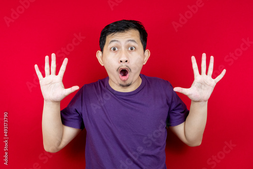 The Asian man was shocked and surprised by the exaggerated facial expressions.