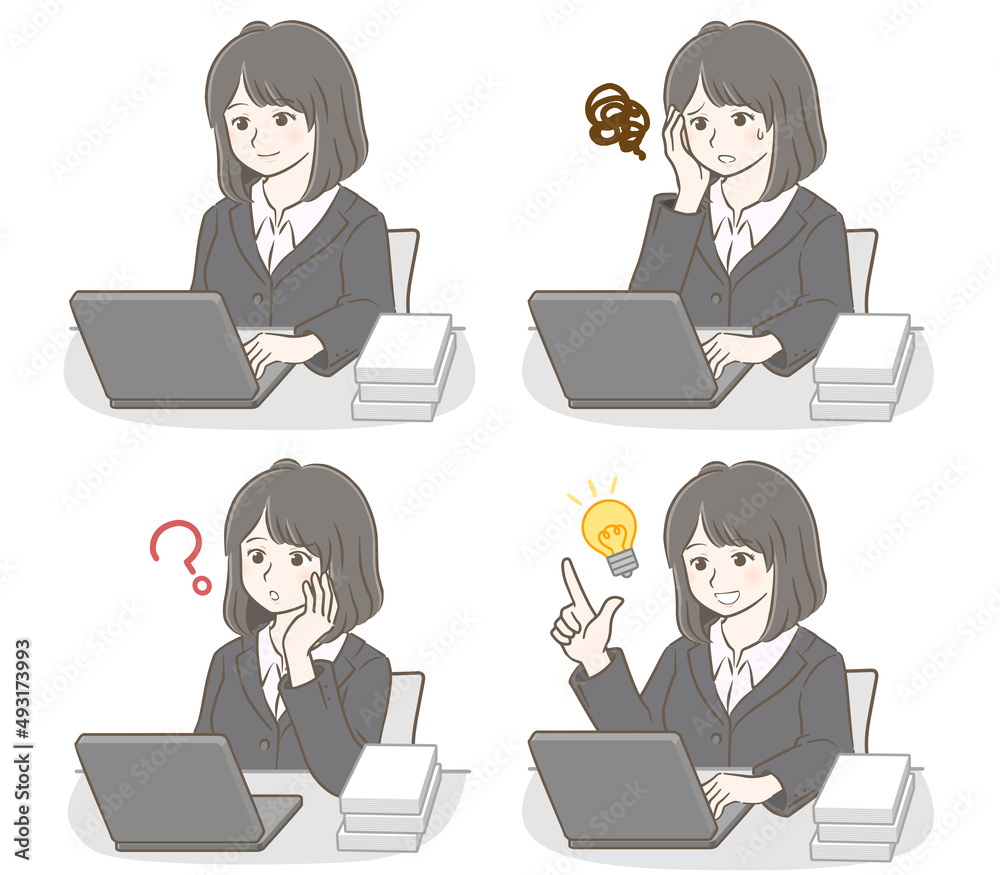 パソコンを操作するスーツの若い女性 パソコンを操作するスーツの若い女性