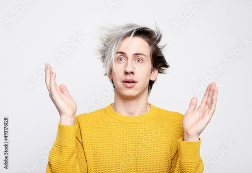 photo of stupefied handsome male has shocked expression, being surprised