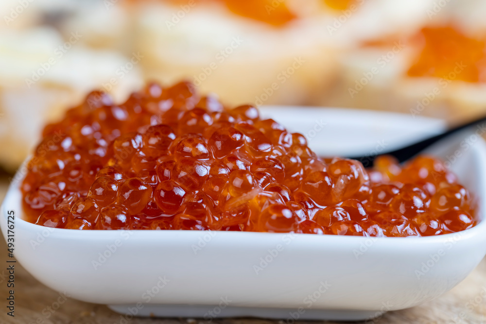 red salmon or trout caviar with white baguette and butter red salmon or trout caviar with white baguette and butter