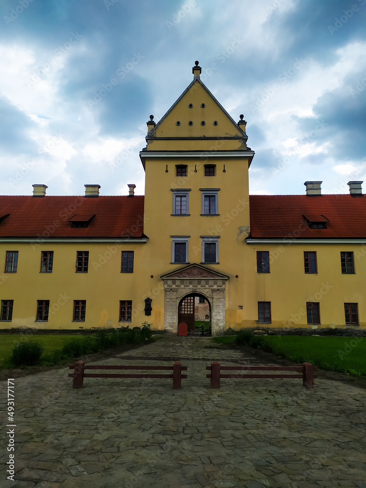 Zhovkva Castle is an architectural monument of the Renaissance in the city of Zhovkva in Lviv region of Ukraine. view of the main gate to renaissance castle on cloudy summer day Zhovkva Castle is an architectural monument of the Renaissance in the city of Zhovkva in Lviv region of Ukraine. view of the main gate to renaissance castle on cloudy summer day