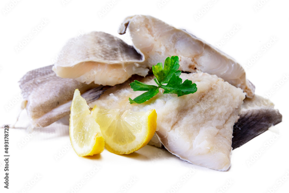 fresh cod with parsley and lemon isolated on white