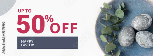 Easter sale banner with easter eggs and flowers.