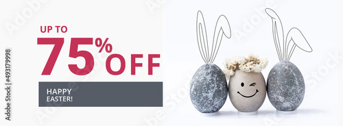 Easter sale banner with easter eggs and rabbit ears.