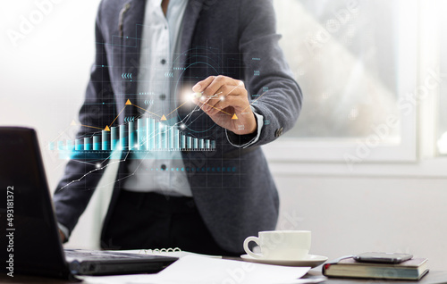 Businessman draw graph growth and analizing data development investment financial,Business planning concept and space background photo