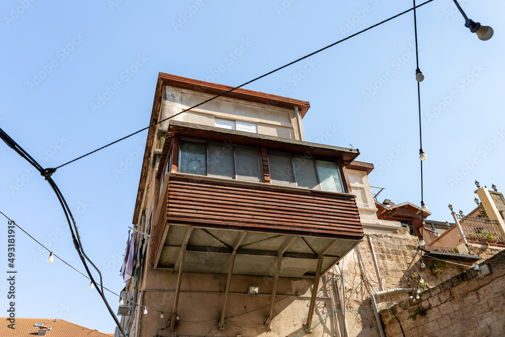 Large wooden balcony on an old building in the old part of Nazareth, northern Israel Large wooden balcony on an old building in the old part of Nazareth, northern Israel