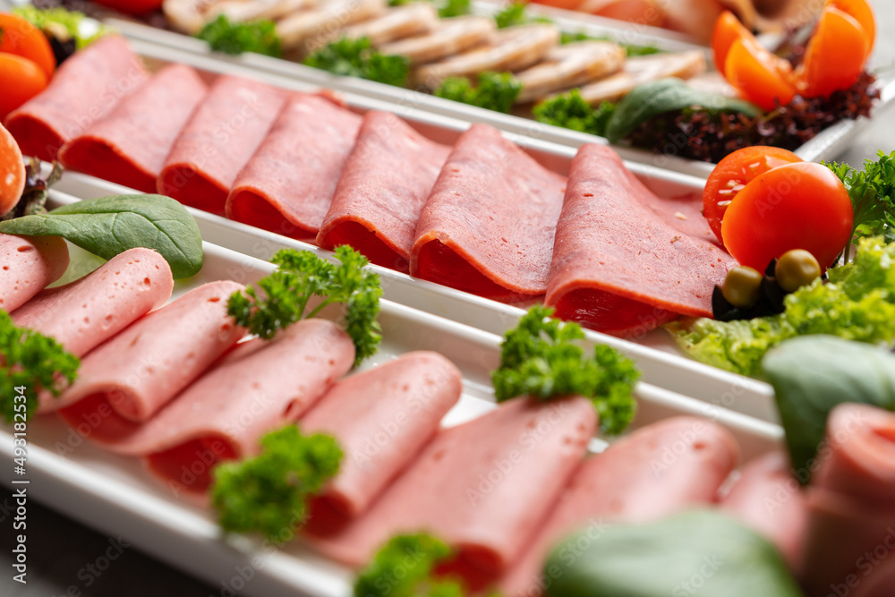 Platter of fresh meat cold cuts on table Platter of fresh meat cold cuts on table