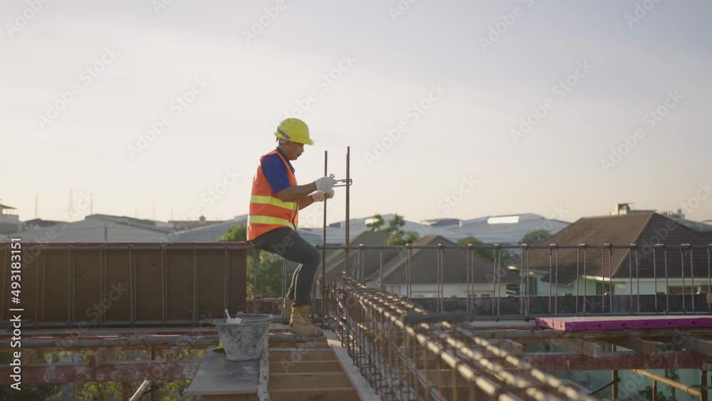 Construction workers tying steel at the construction site. Construction workers tying steel at the construction site.