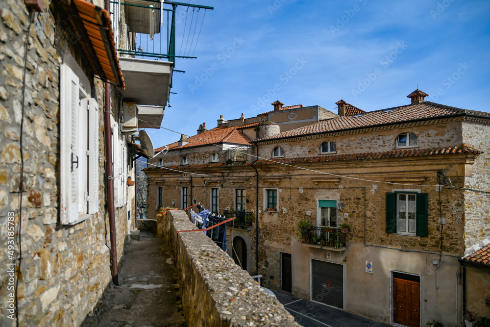 A narrow street among the old stone houses of Castellabate, town in Salerno province, Italy.	