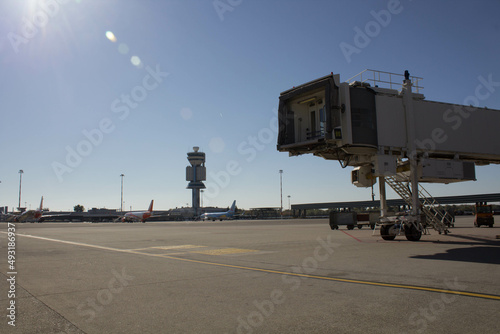 evocative image of the final part of a finger of a
European airport on a beautiful day