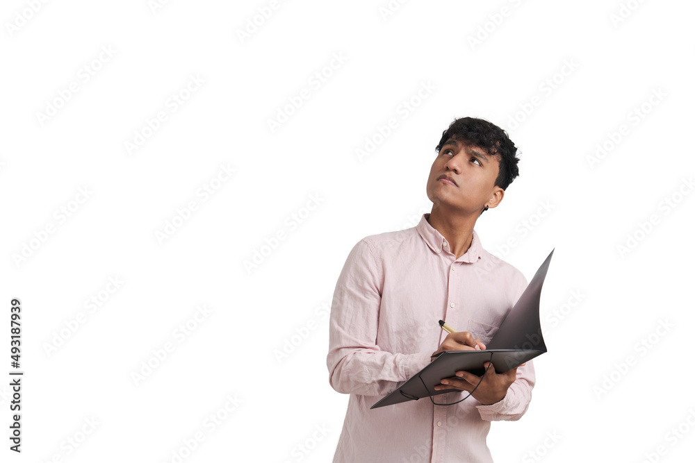 Young peruvian man looking up and writing on a folder with a pen. Isolated over white background. Young peruvian man looking up and writing on a folder with a pen. Isolated over white background.
