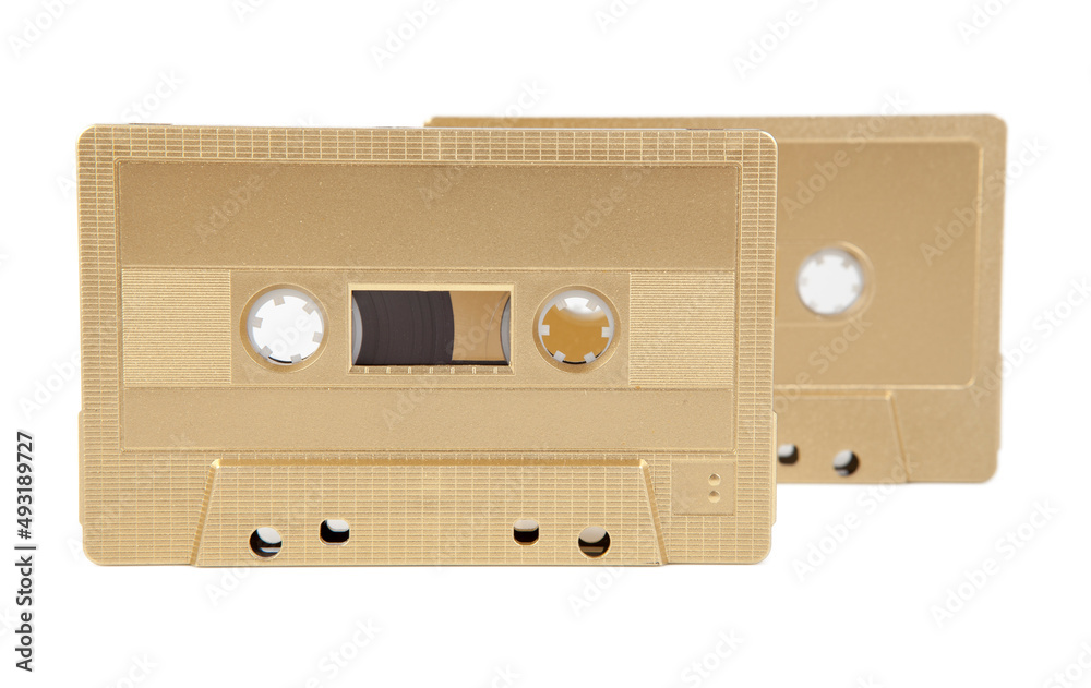 Obraz premium A golden cassette tape on the white background