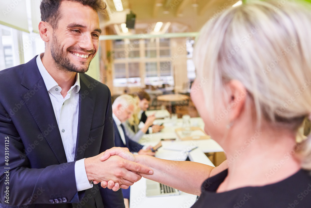 Business people shaking hands as congratulation Business people shaking hands as congratulation
