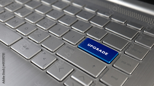 Keyboard with upgrade text on the enter button, represents upgrade, metaphor of signs
