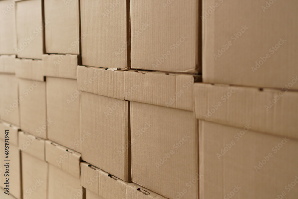Set of cardboard brown boxes in storehouse. Background of carton boxes in wsrehouse Set of cardboard brown boxes in storehouse. Background of carton boxes in wsrehouse