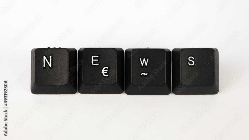 News text created with keyboard keys isolated on white background, white news letters on black keyboard, top view News text created with keyboard keys isolated on white background, white news letters on black keyboard, top view