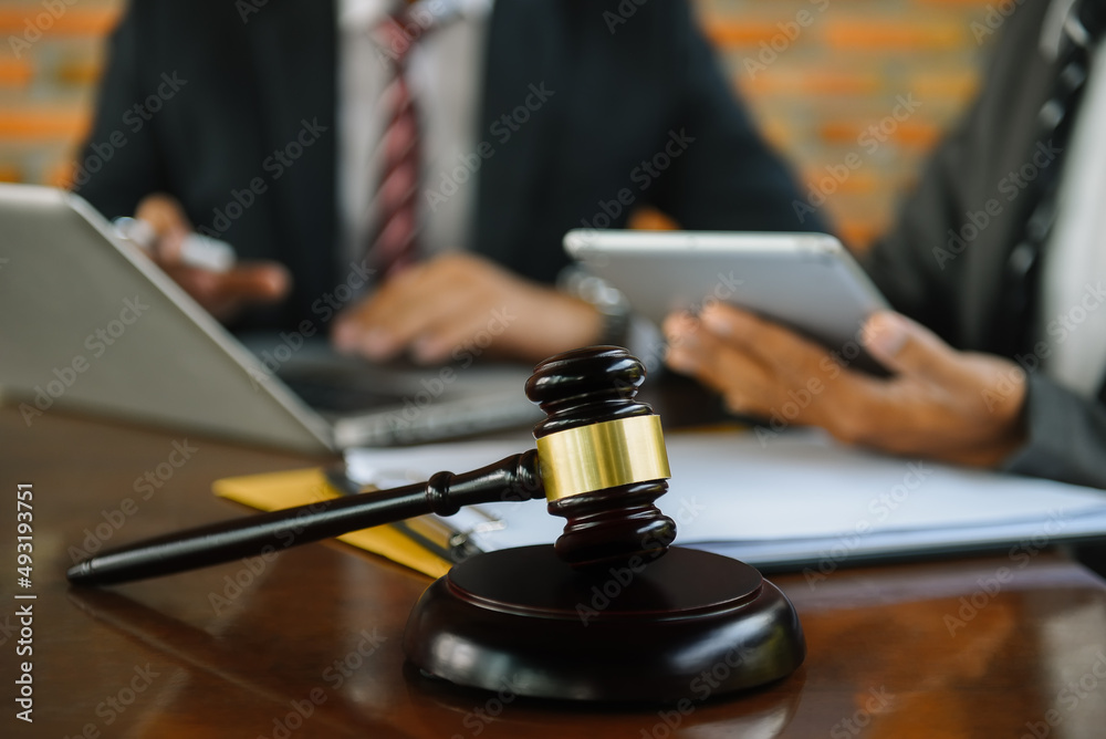 Lawyer or judge consult haveing team meeting at law office. Law and Legal services concept. Lawyer or judge consult haveing team meeting at law office. Law and Legal services concept.