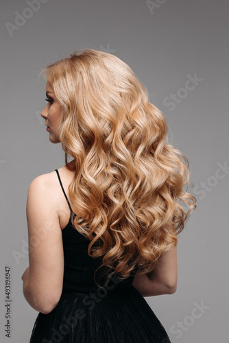 Stunning woman with perfect wavy blonde hair.