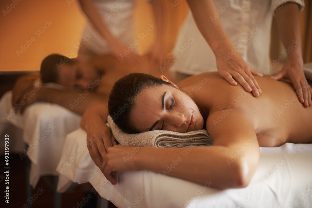 Theres no such word as stress in this room. Shot of a mature couple enjoying a relaxing massage. Theres no such word as stress in this room. Shot of a mature couple enjoying a relaxing massage.