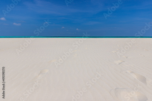 Amazing nature of tropical summer beach. White sandy beach  lagoon sea water against blue sky with white clouds. Copy space  summer vacation concept  tranquil relaxing turquoise ocean  freedom travel