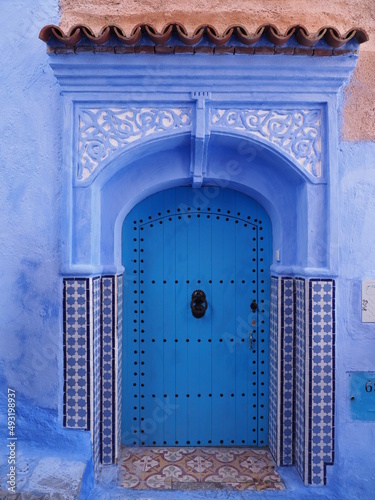 Arabic eave over door in african Chefchaouen town, Morocco - vertical