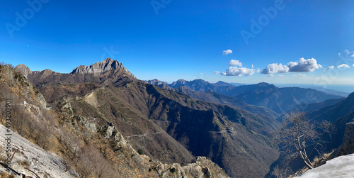 Vista invernale delle Alpi Apuane nella zona della Versilia, la montagna in primo piano è il monte Corchia photo