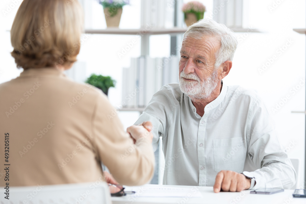 senior businessman shaking hands and congratulations for a new job senior businessman shaking hands and congratulations for a new job