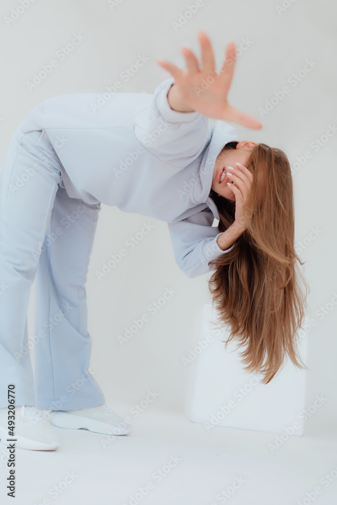 Ukrainian young woman in sweatshirt mock up on light background. Female body and style concept. Advertisement or clothes sale design. Mock up for design, clothes shop sale. Close up emotional woman Ukrainian young woman in sweatshirt mock up on light background. Female body and style concept. Advertisement or clothes sale design. Mock up for design, clothes shop sale. Close up emotional woman