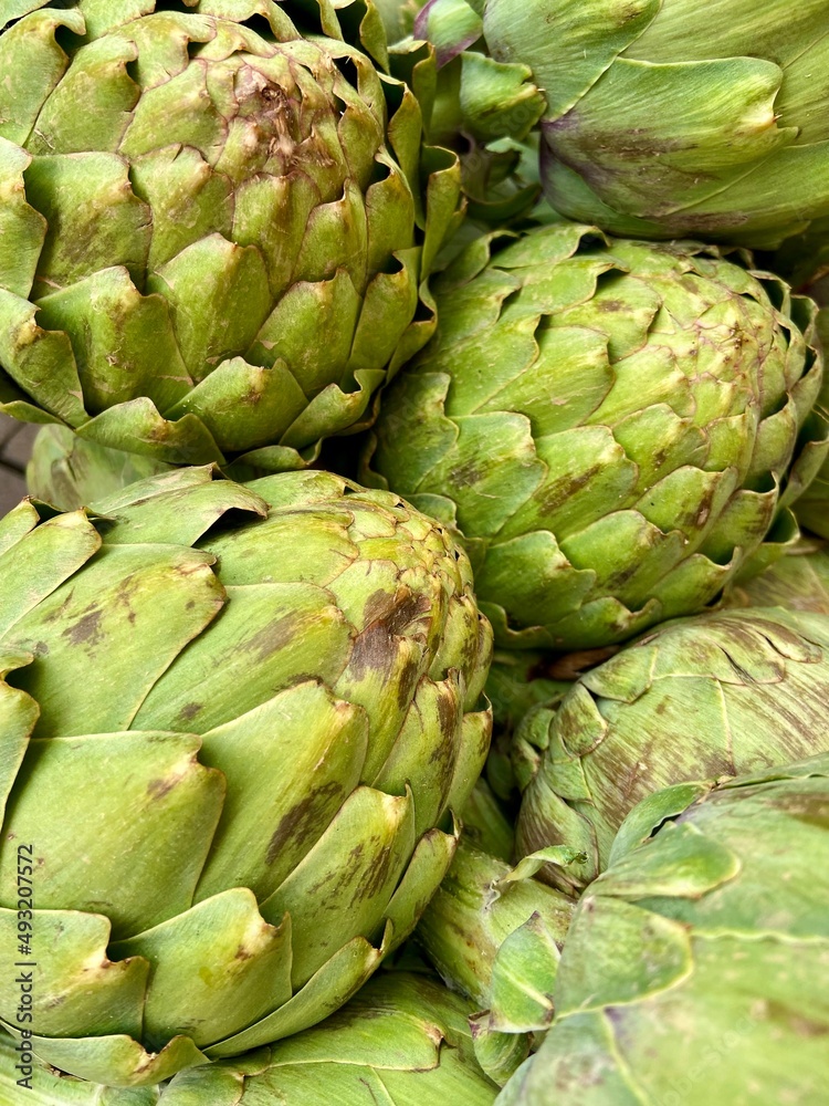 green artichokes close-up in the store green artichokes close-up in the store