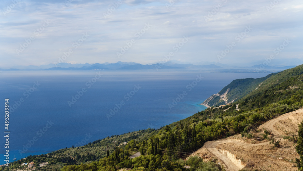 Landscape of Lefkada Island, Greece. impressive landscape and blue sea with cloudy sky Landscape of Lefkada Island, Greece. impressive landscape and blue sea with cloudy sky
