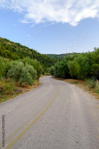 Countryside road in Greece with olive trees and hills. © 22Imagesstudio