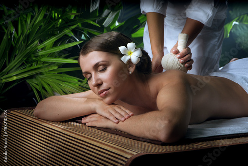 portrait of young beautiful woman in spa environment.  