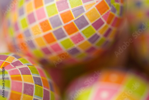 Easter egg decorations--close-up, full frame, abstract, image focus technique background texture of colorful, check pattern, paper covered Easter eggs